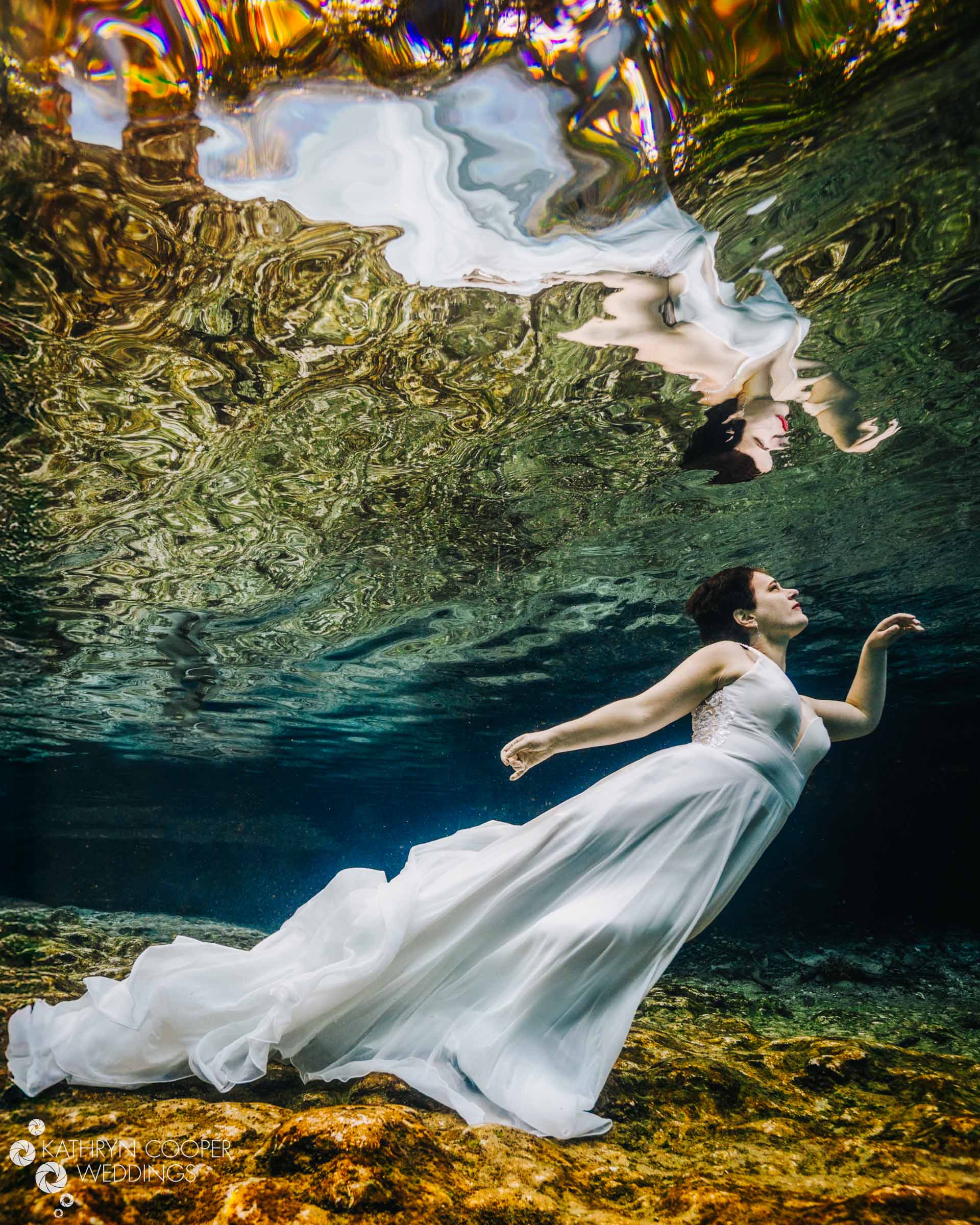 Underwater bridal shoot in a spring with manatees