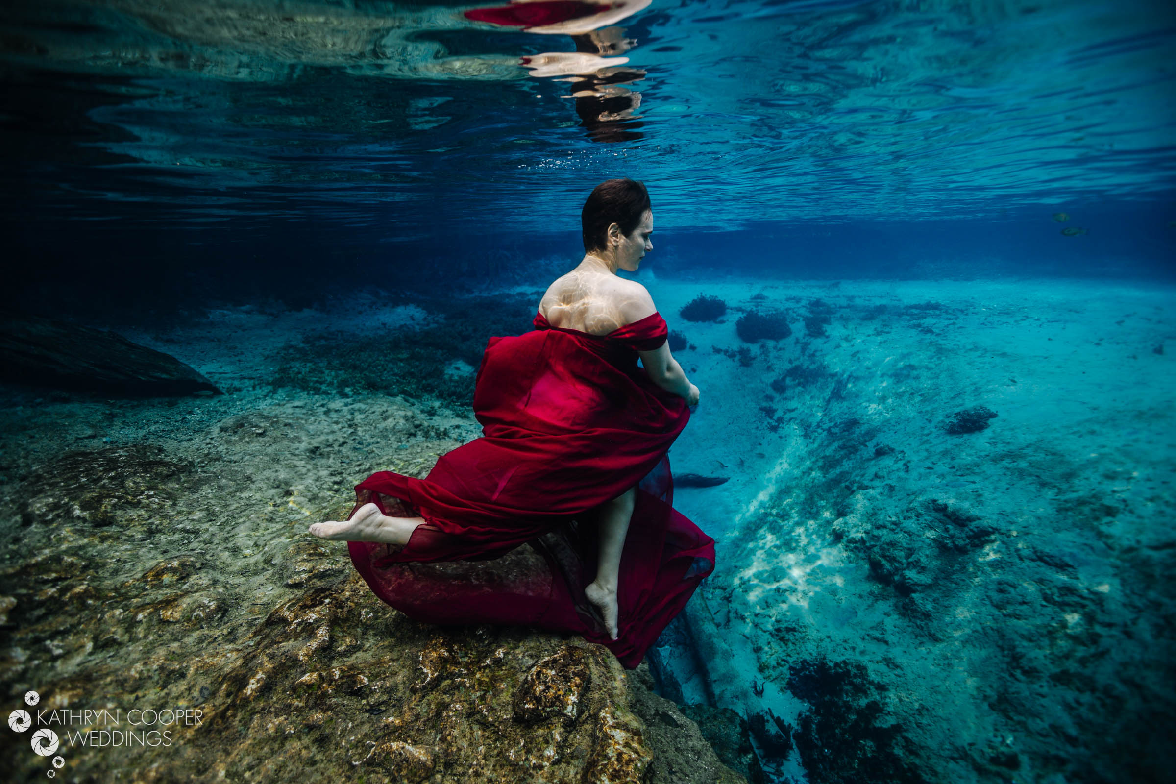 Running in the water: Engagement photos underwater, Florida springs by www.KathrynCooperWeddings.com