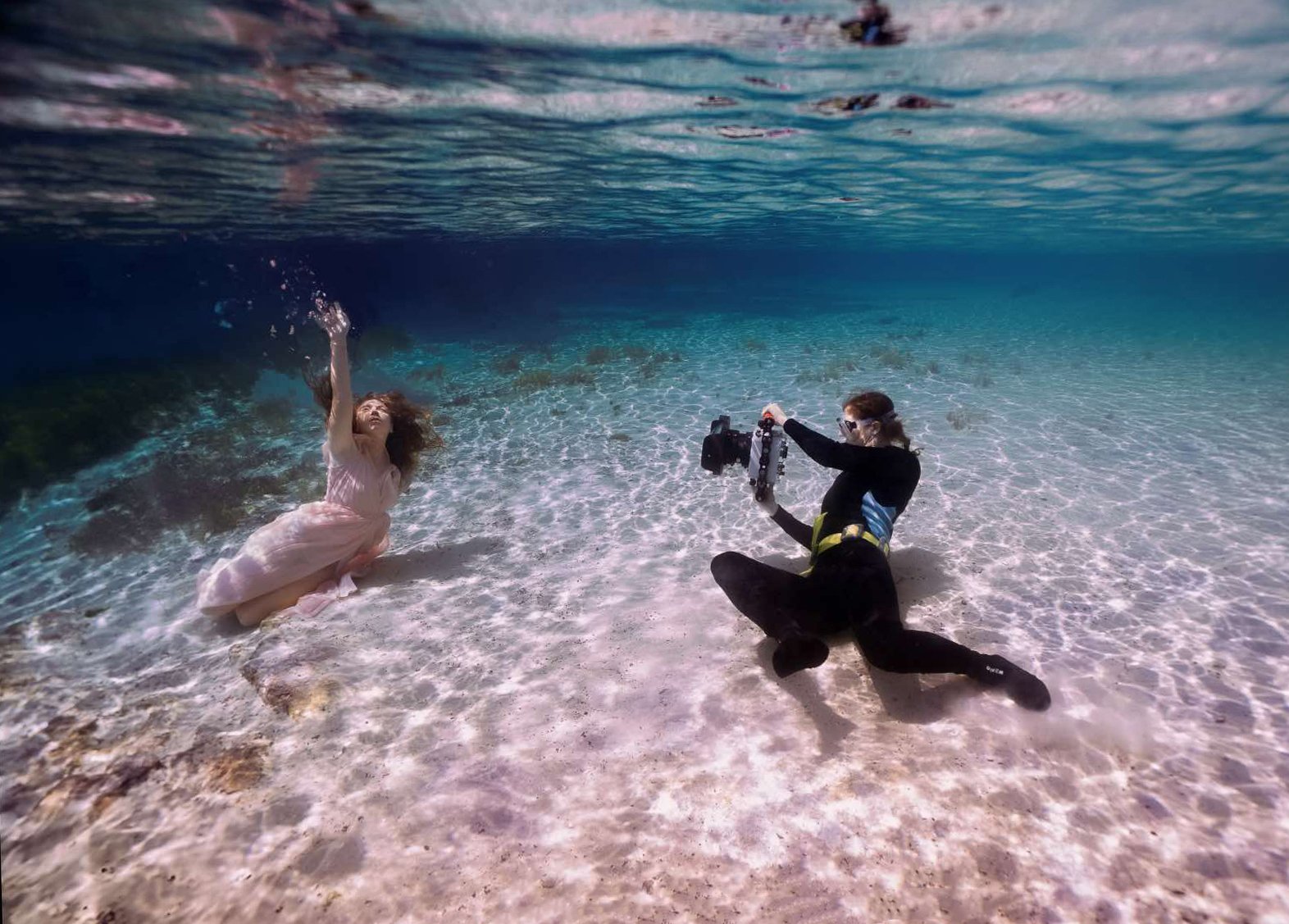 Kathryn Cooper Weddings photographing underwater