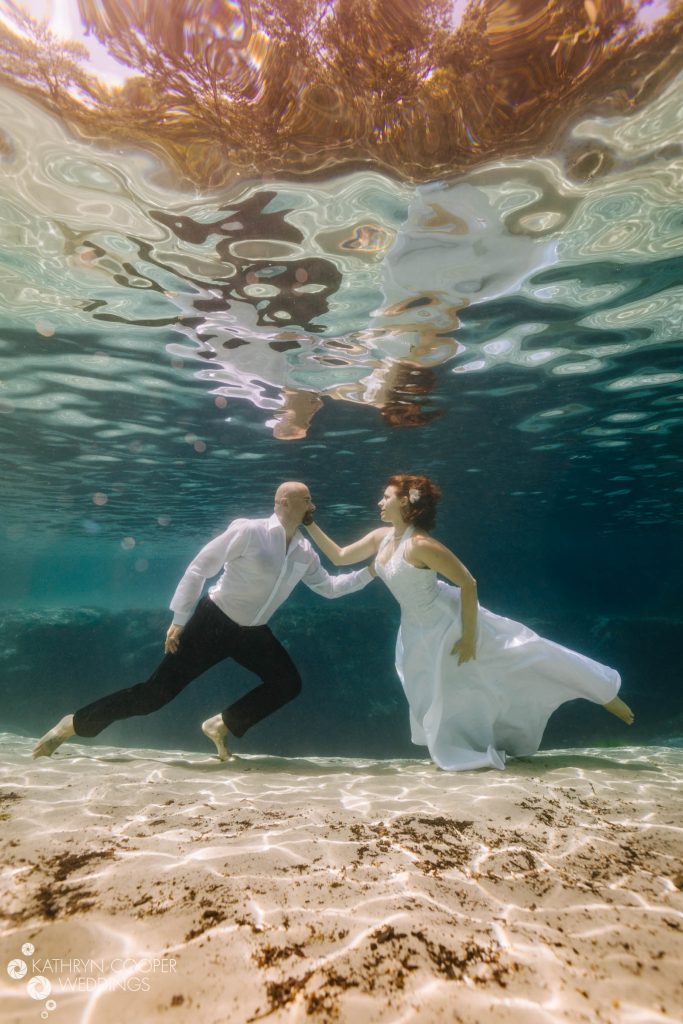 Photos of couples underwater in a cenote