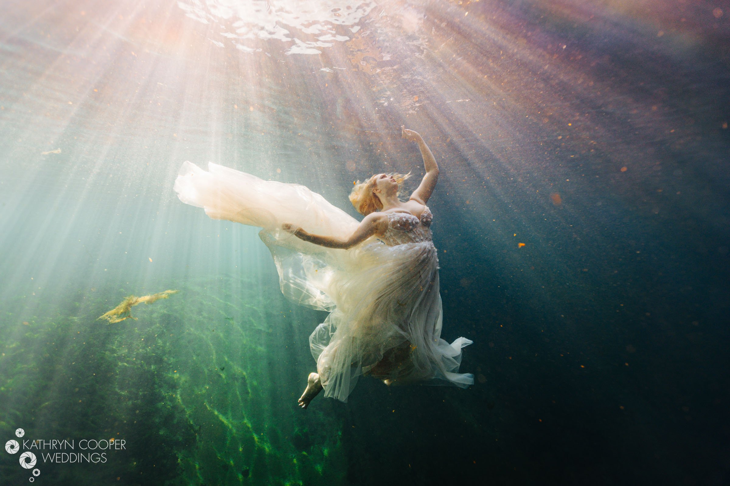 Mermaid Kalynn modeling for underwater bridal photos