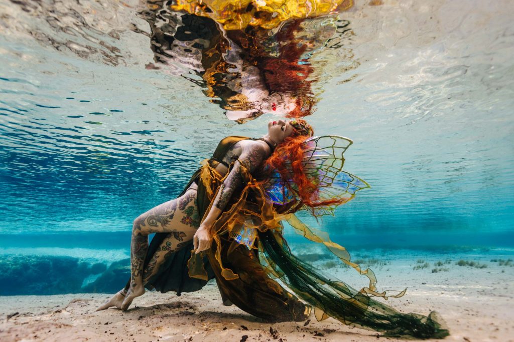 Ms. Luna Marie, tattooed mermaid, in a Florida spring. Haley Smith -Photography by Kathryn Cooper Weddings